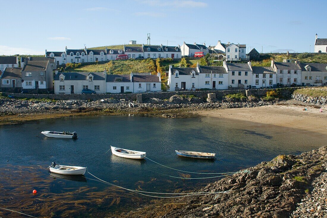 Small Boats In The Water Near Houses