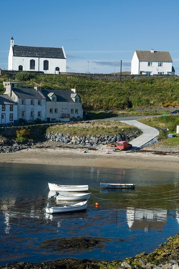 Small Boats In The Water Near Houses