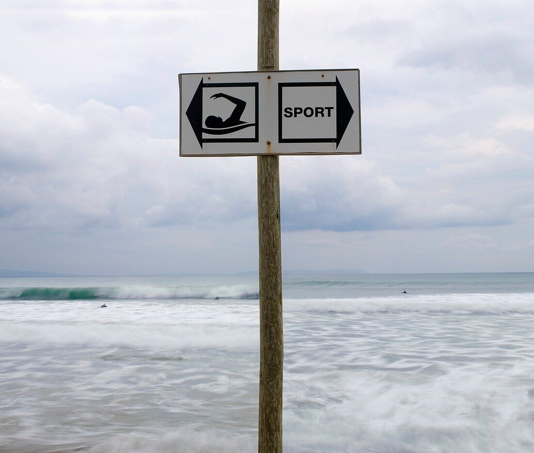 A Swimming Sign At A Beach