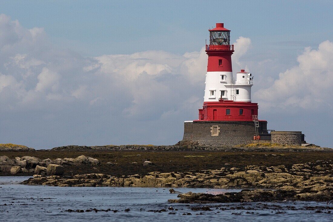 A Lighthouse On A Shoreline