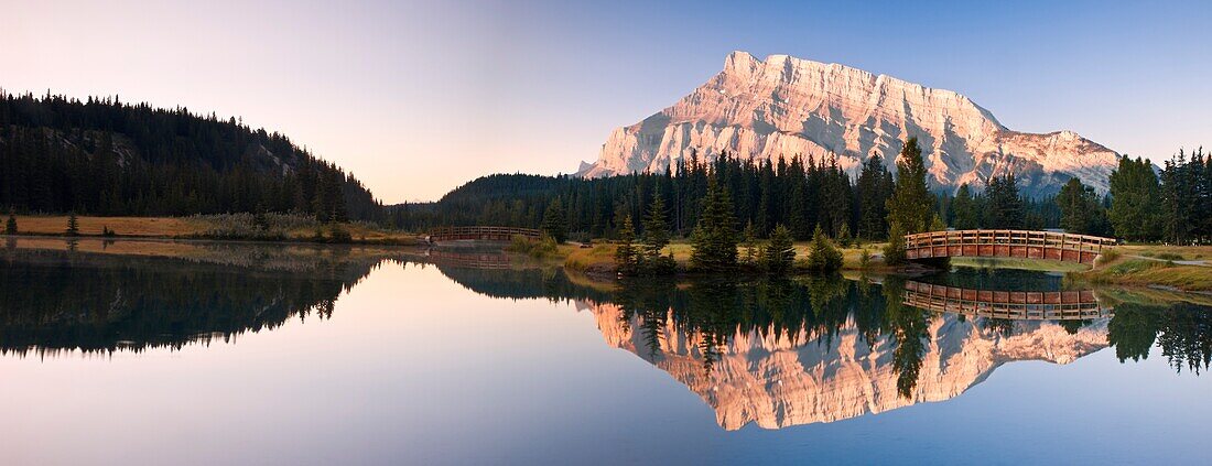 A Scenic Shot Of A Mountainside And Small Bridge; Banff National Park,Alberta,Canada