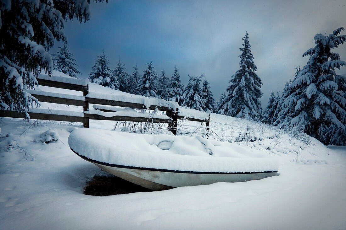 Small Boat By A Fence In Winter