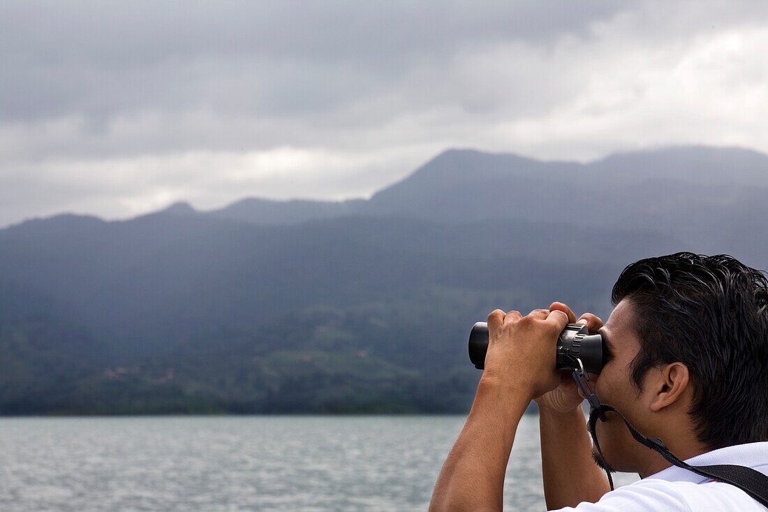 Hispanic Man Looking Through Binoculars, Costa Rica