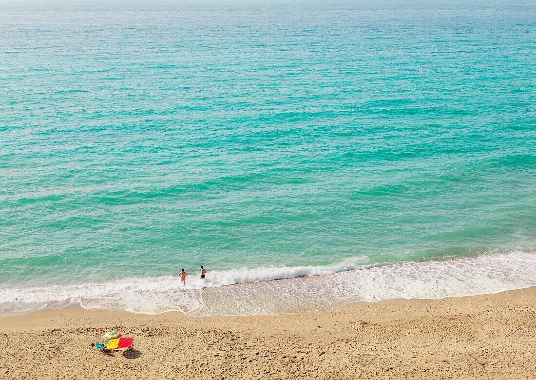 Couple On Empty Beach; Nerja, Costa Del Sol, Malaga, Spain