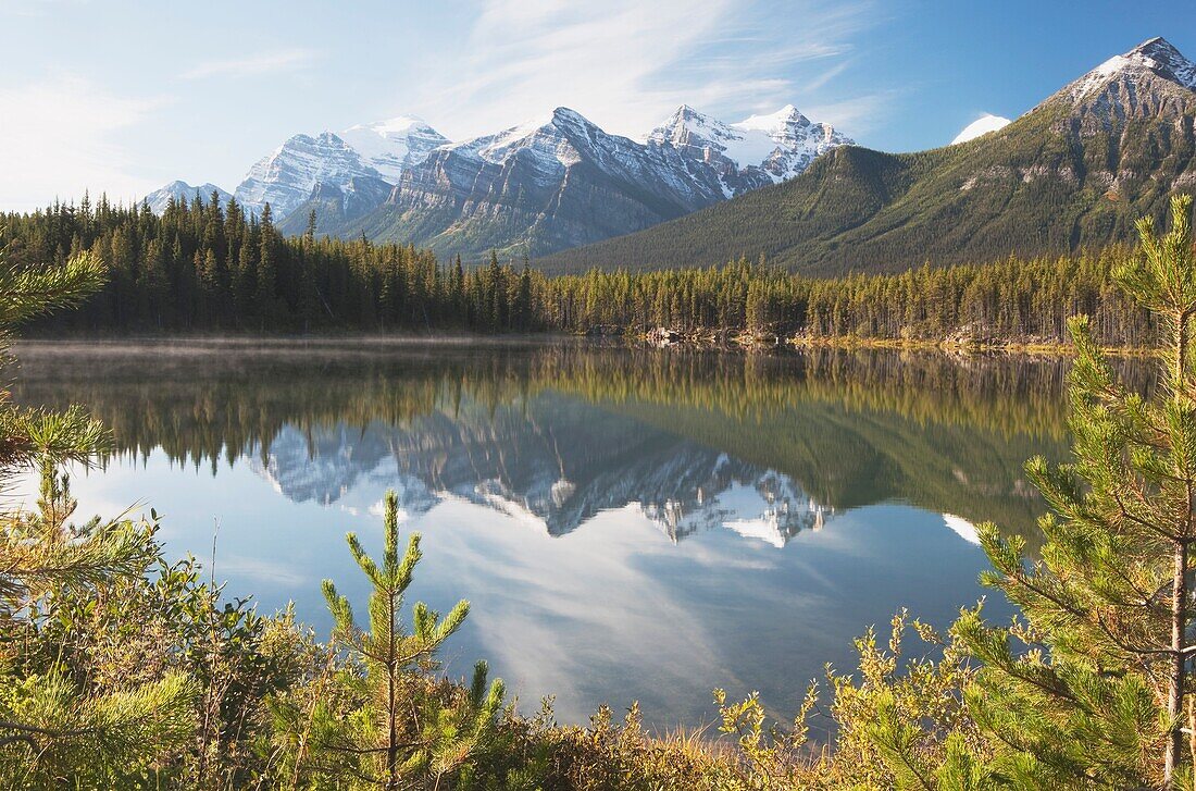 Banff National Park, Alberta, Canada; Mountains Reflected In A Lake In Late Summer
