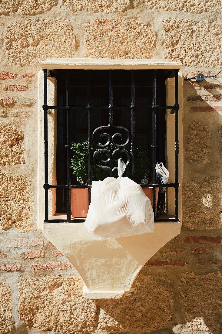 Daily Newspaper And Morning Bread Tucked In Window Grill, Ronda, Spain