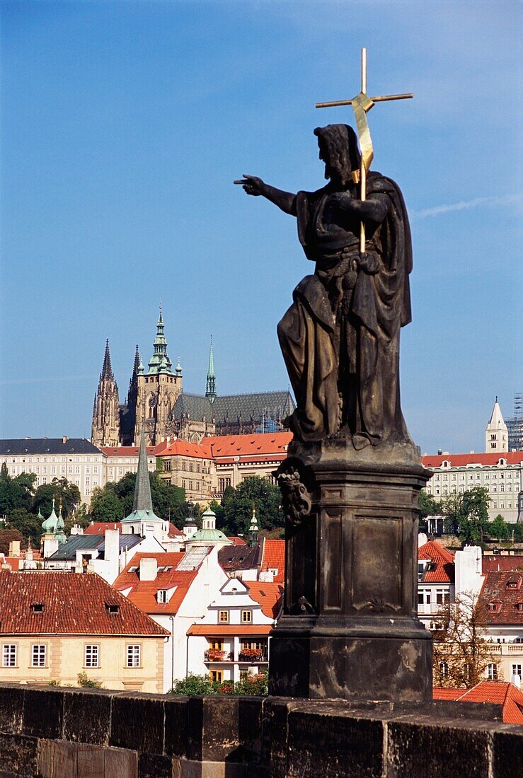 Statue On Charles Bridge With Hradcany In Background