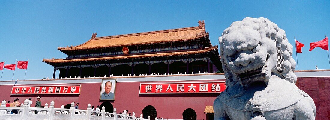 Stone Lion Statue And Portrait Of Mao On Tiamanmen