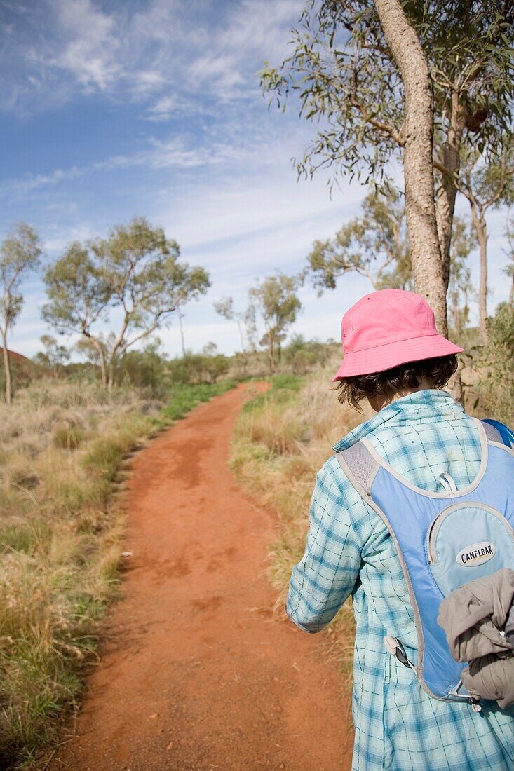 Woman Walking Down Path In Kata Tjuta Park