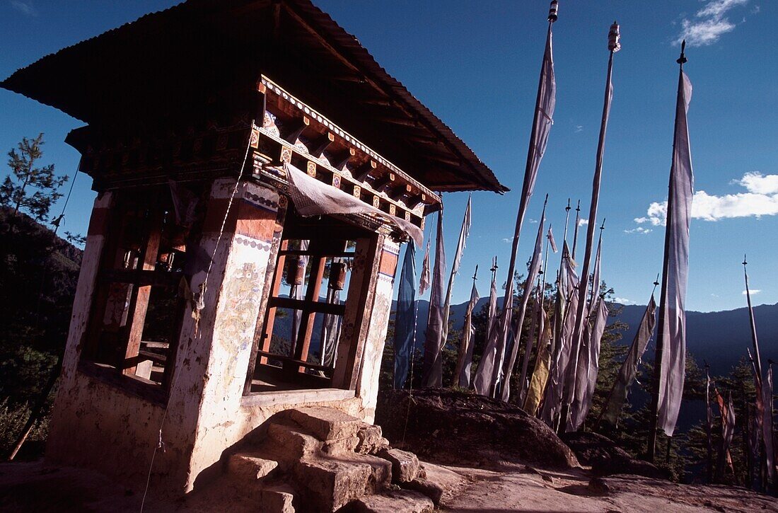 Stups With Prayer Wheels Surrounded By Prayer Flags