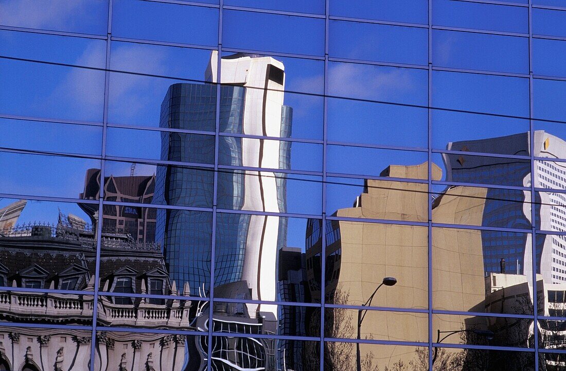 Skyscrapers Reflected In Modern Glass Building