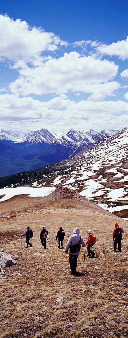 Tourists Hiking In The Rockies