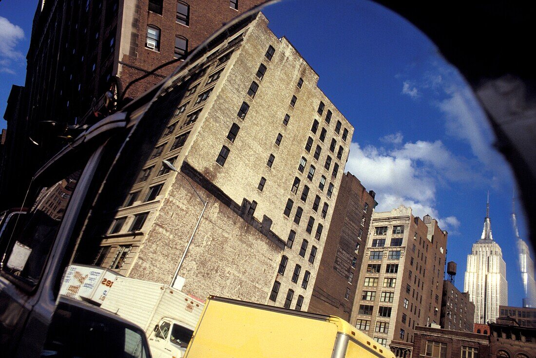 Reflections Of Empire State Building In Mirror