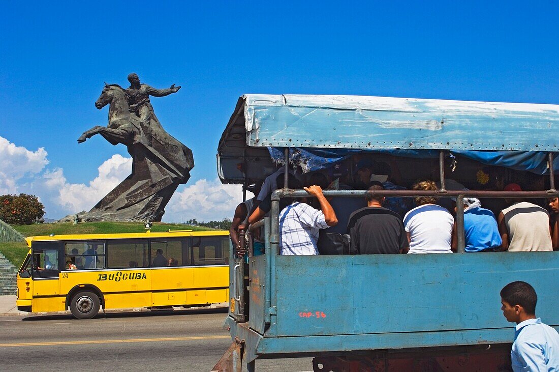 A People-Carrying Truck By The Statue Of Antonio Maceo In The Plaza De La Revolucion.