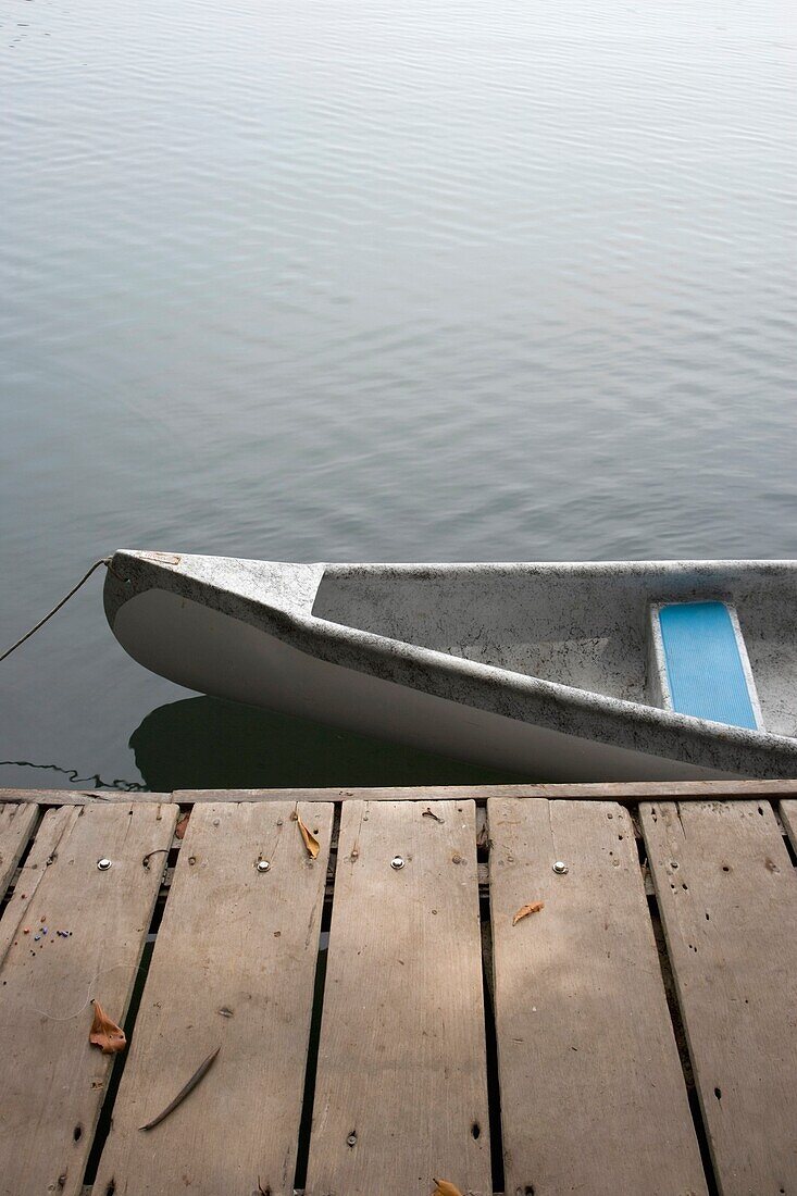 Canoe Tied To Jetty