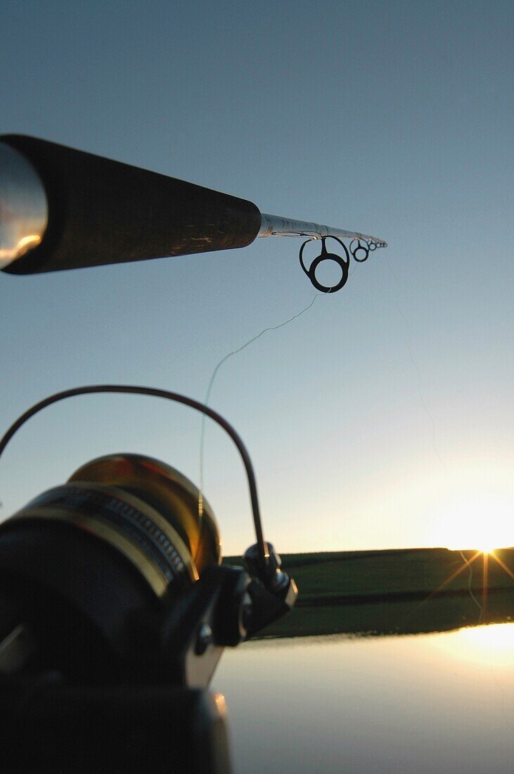 Fishing Rod Casting Over A Pond