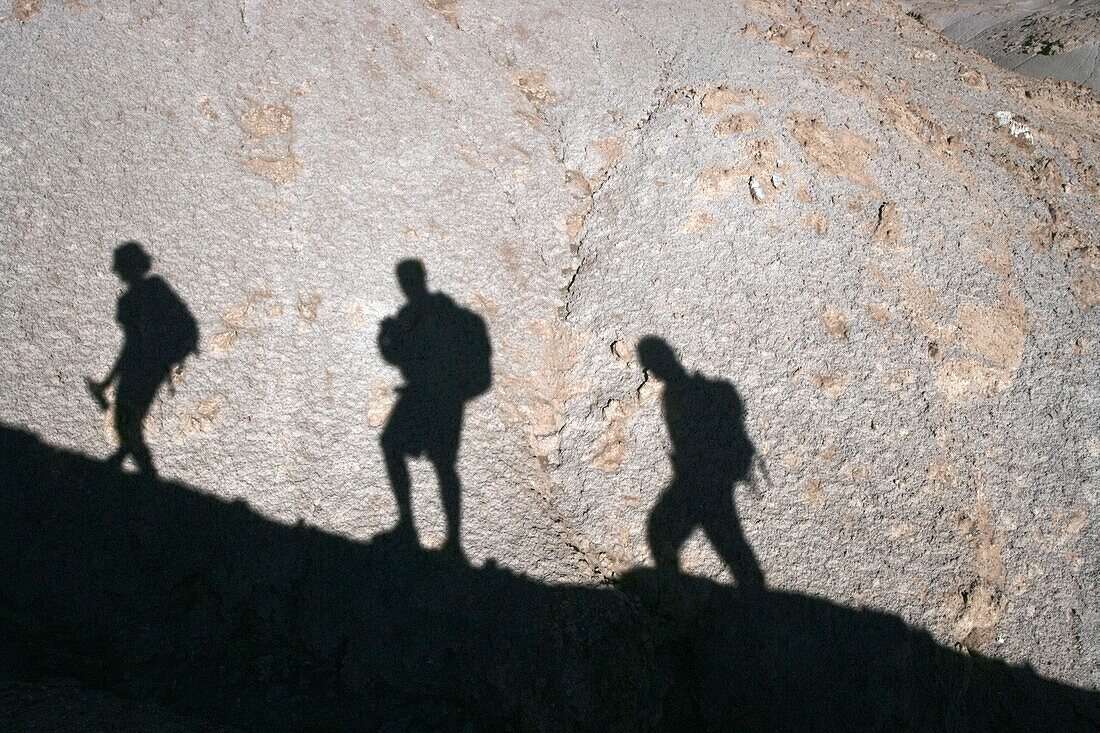 Shadows Of Hikers Ascending Hill
