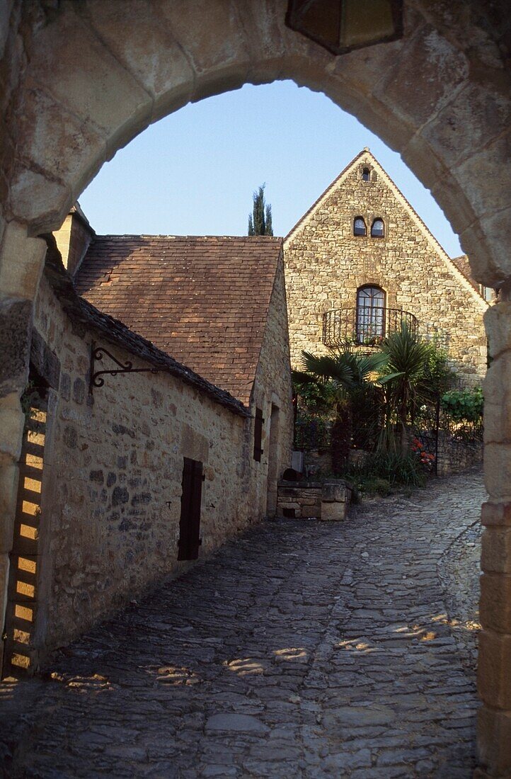 Cobbled Street Under Archway