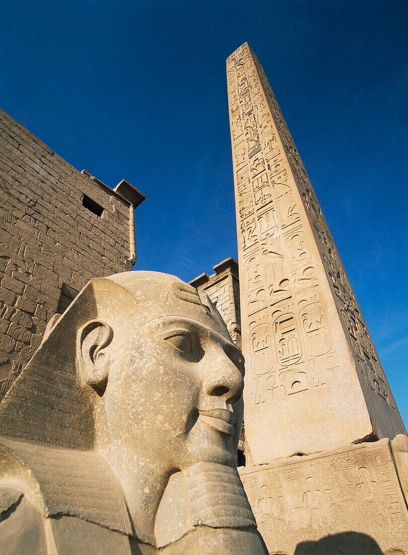 Detail Of Head Of Pharaoh In Front Of Obelisk