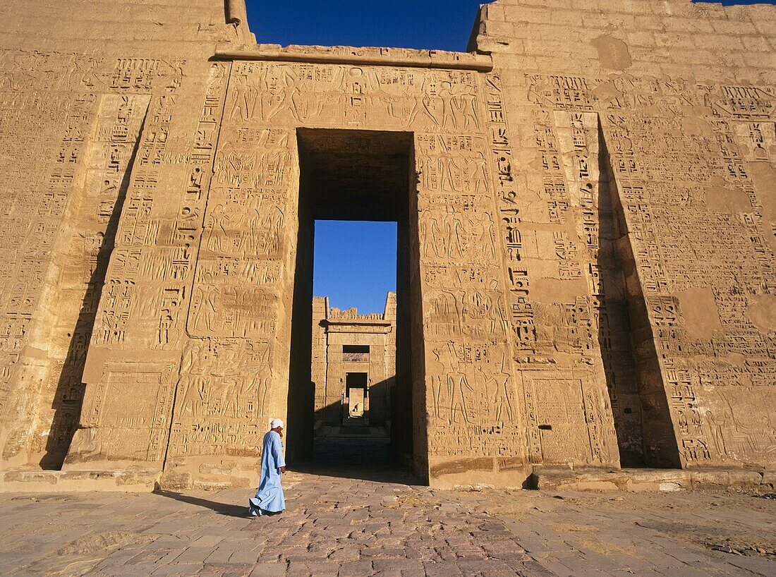 Man Walking By Medina Habu Temple