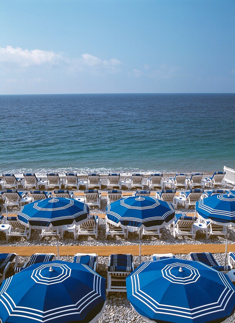 Umbrellas And Sun Beds On The Beach