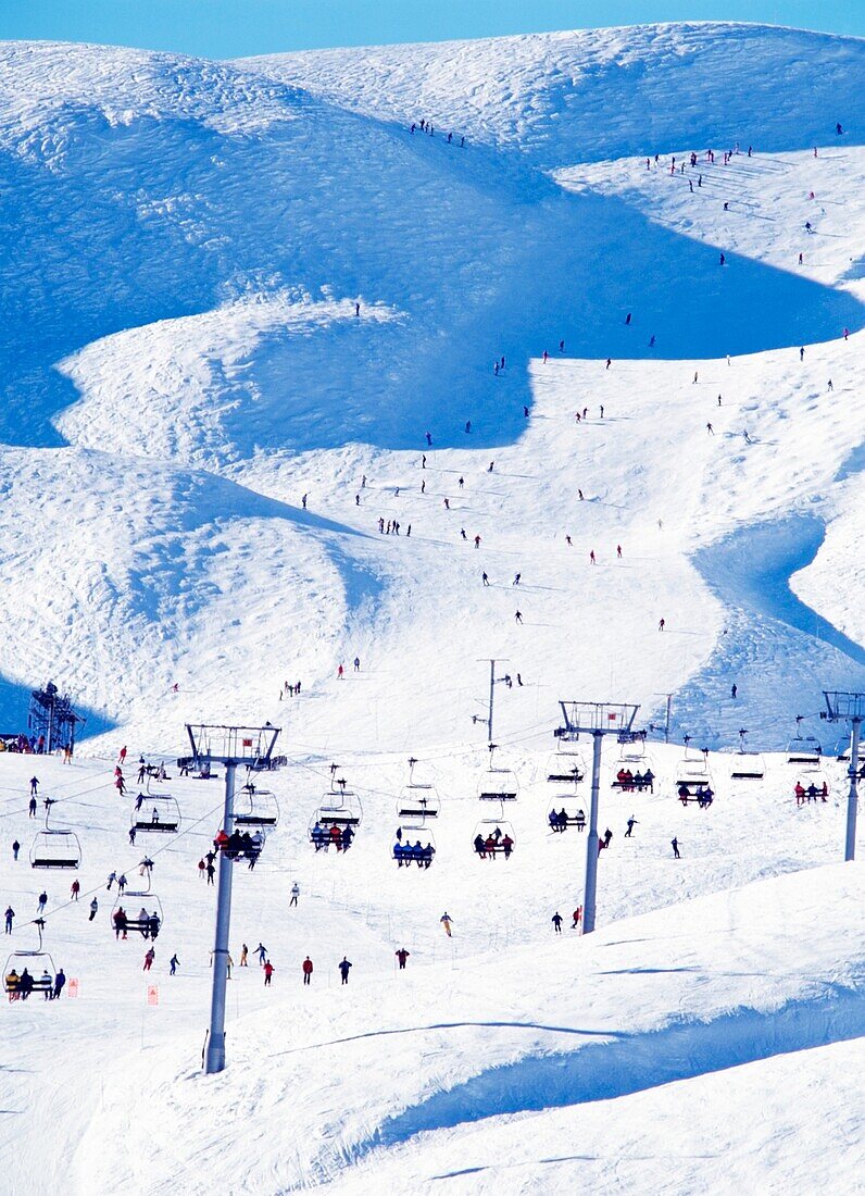 Crowded Slopes & Chairlift In The Alps