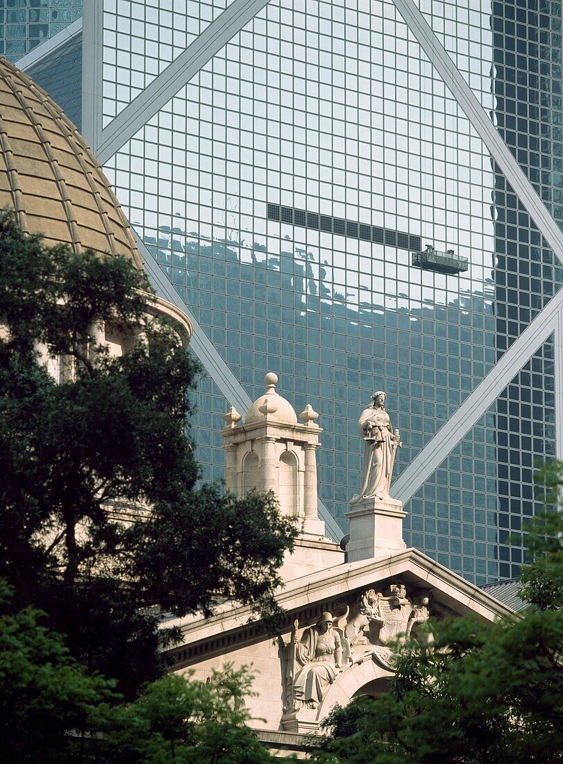 Old Building In Front Of The Bank Of China Tower