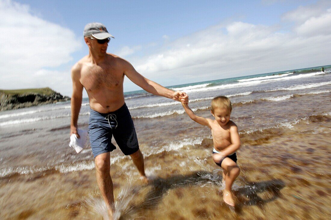 Father With Son On The Beach