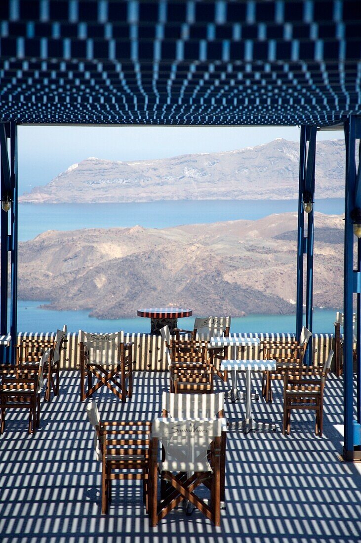 Table And Chairs On Coastline Roof Terrace Covered By A Pergola