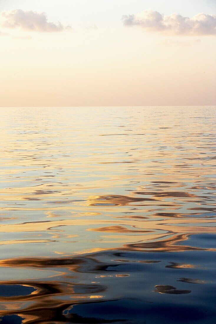 Calm Sea Surface With Sunset, Low Angle View