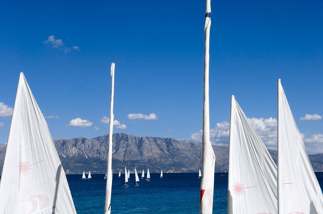 Yachts Sailing Near Shore Of The Island Lefkas.