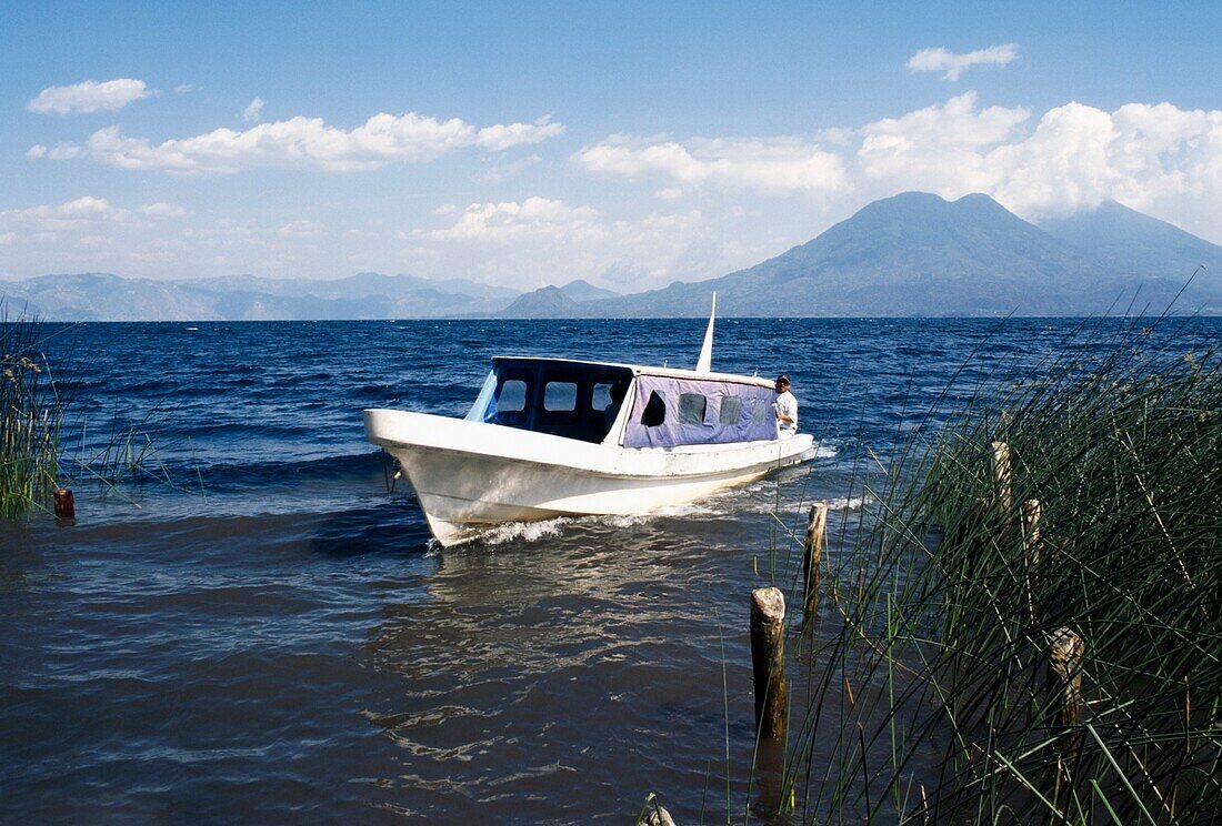 A Boat On A Boat Tour Gliding Over Water.