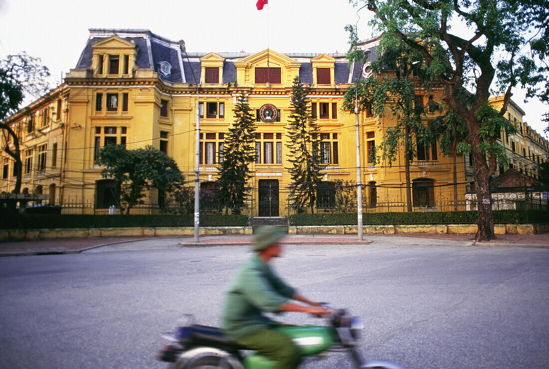 Man On Scooter Driving On Trang Tien Street In Hanoi, Blurred Motion