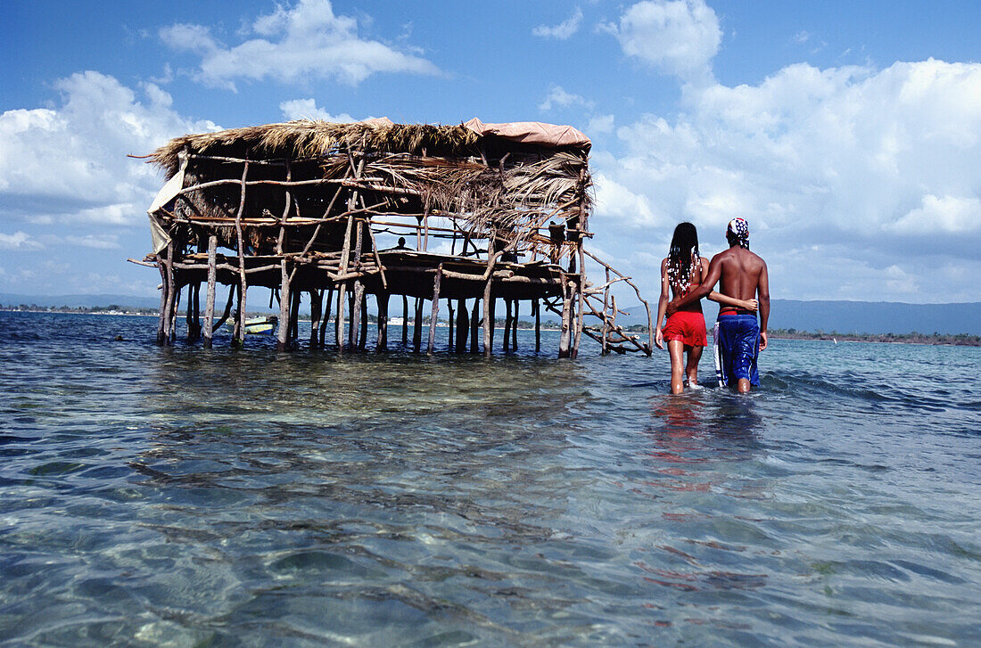 Couple Walking Towards Pelican Bar