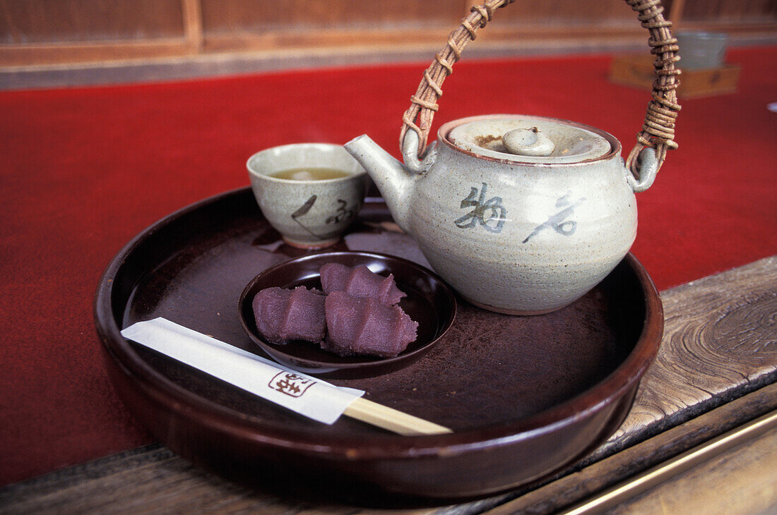 Tea Pot On Tray With Sweet In A Japanese Tea House