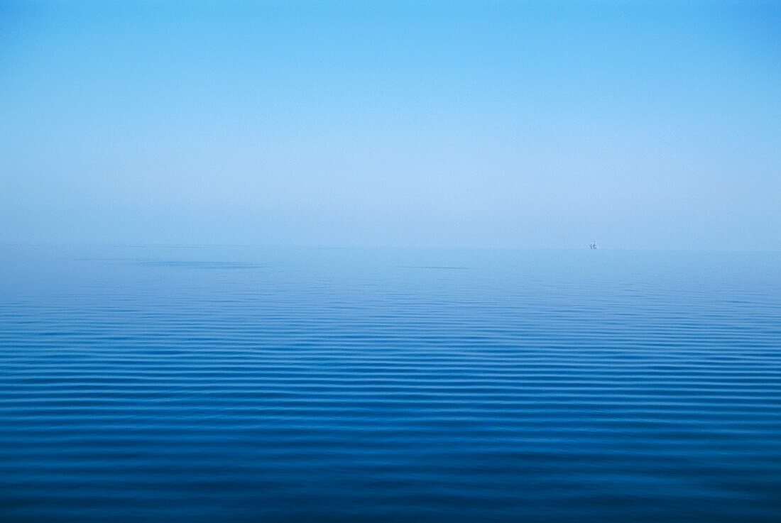 Calm Blue Water Disappearing Into Horizon