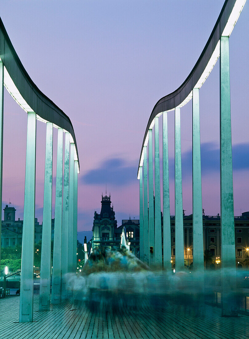 Spain, Blurred Motion; Barcelona, People Walking Across The Swing Bridge At Dusk