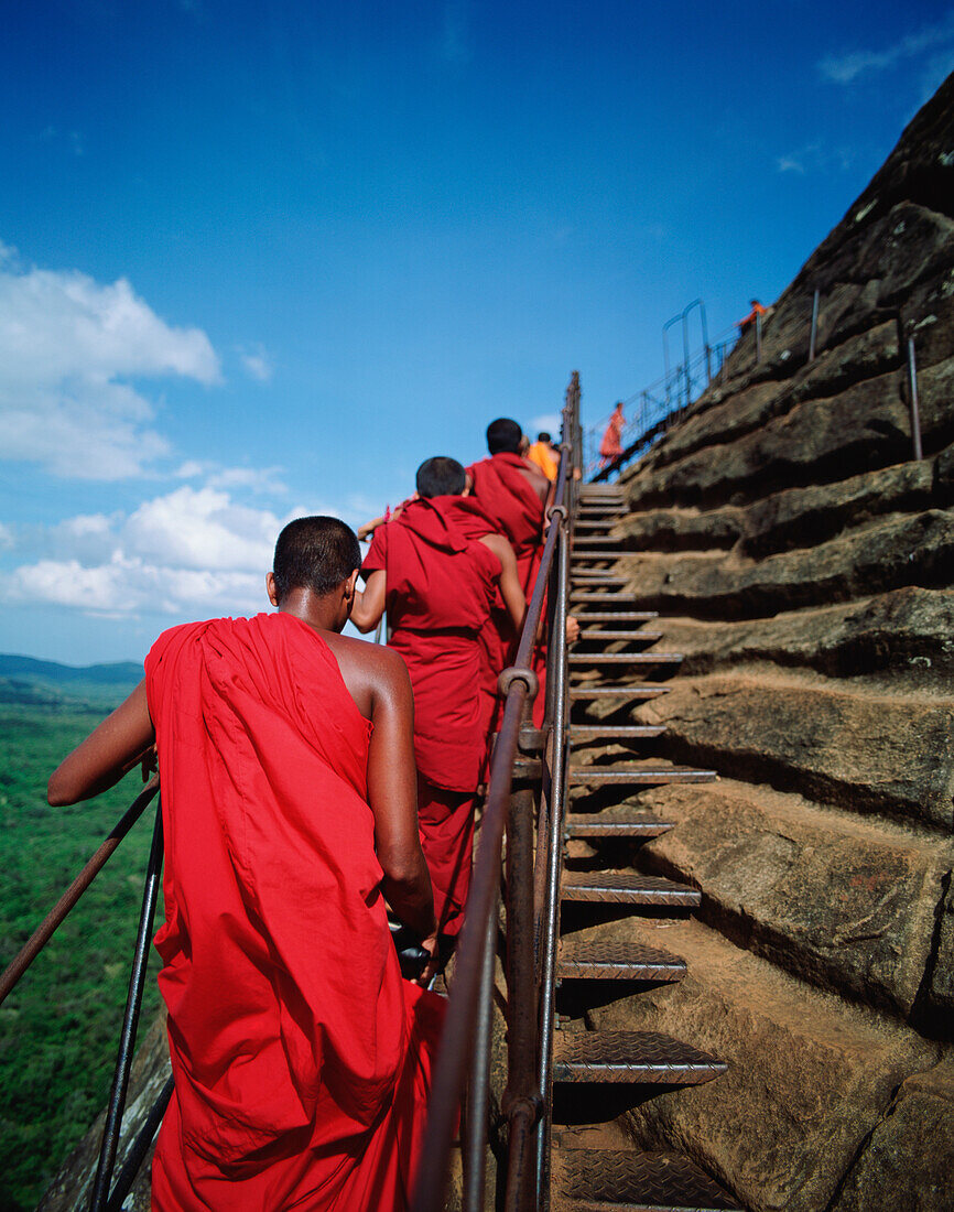 Buddhist Monks Climbing Steps Of Sigiriya Rock Fortress
