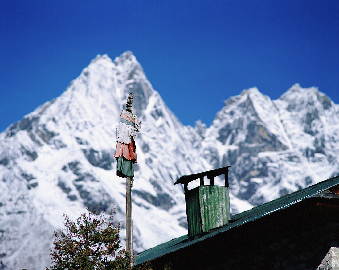 Prayer Flag, Chimney, Lodge Roof And Himalayan Mountains, Deboche, Sagarmatha National Park, Close Up\