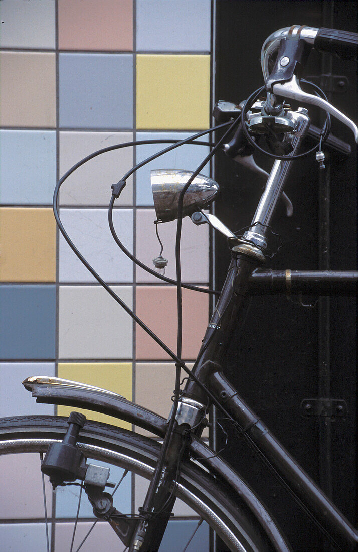 Bicycle And Tiled Wall In Amsterdam