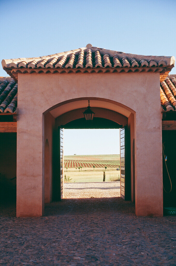 Looking Through Archway To Fields