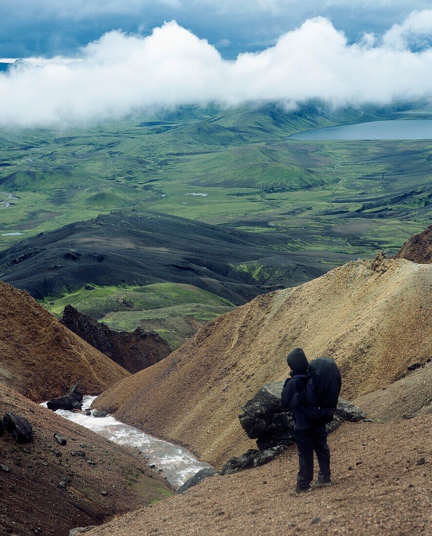 Backpacker Looking Over Wild Landscape, High Angle View