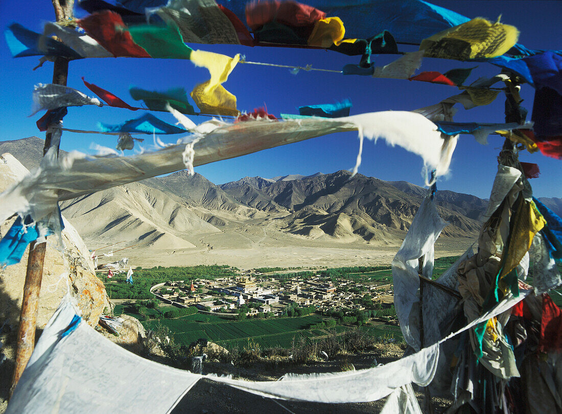 Looking Through Prayer Flags At Dawn To Samye Monastery