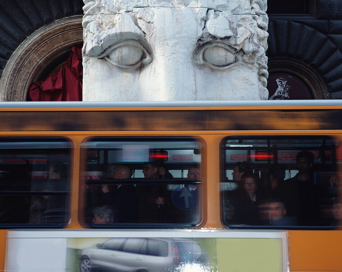 Bus Passing Statue At Museo Del Corso, Blurred Motion