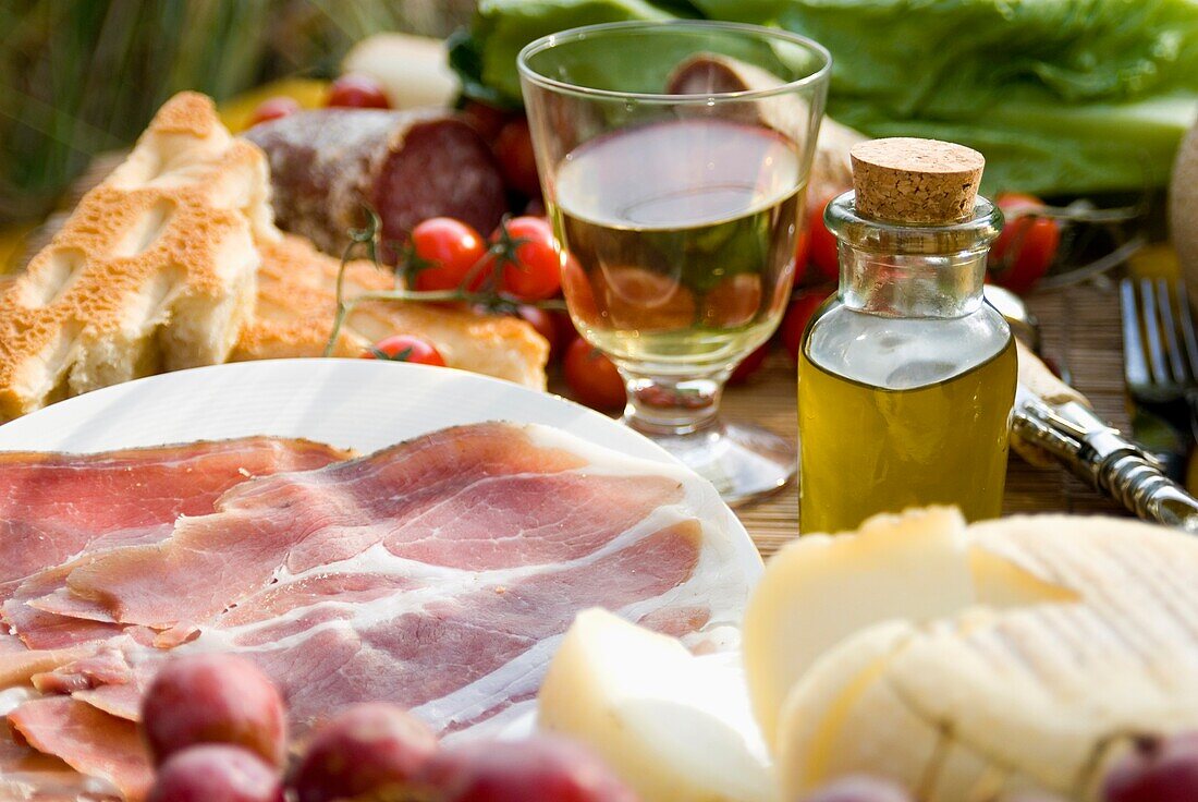 Prosciutto Ham, Cheese, Tomatoes, White Wine, Bread And Olive Oil, Close Up