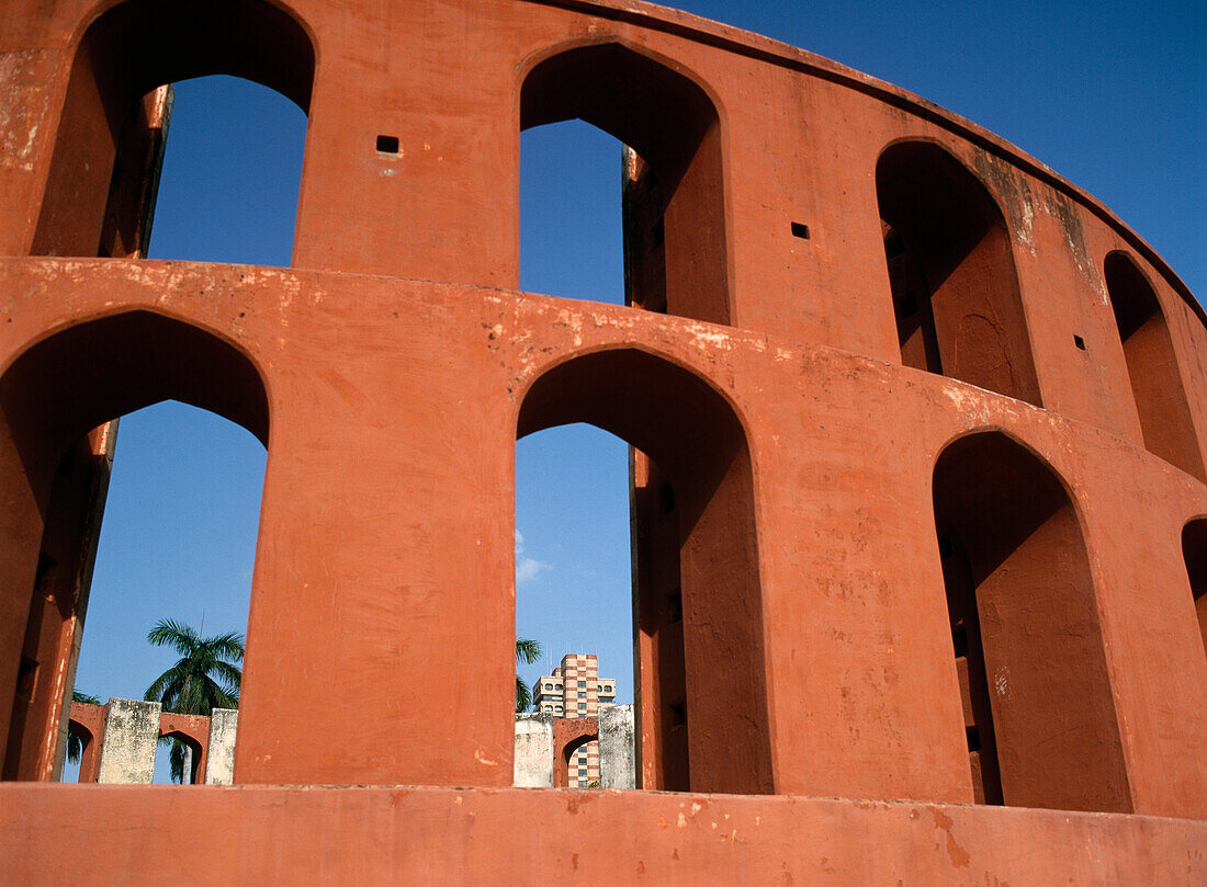 Looking Through Part Of The Jantar Mantar Observatory Towards The Office Blocks