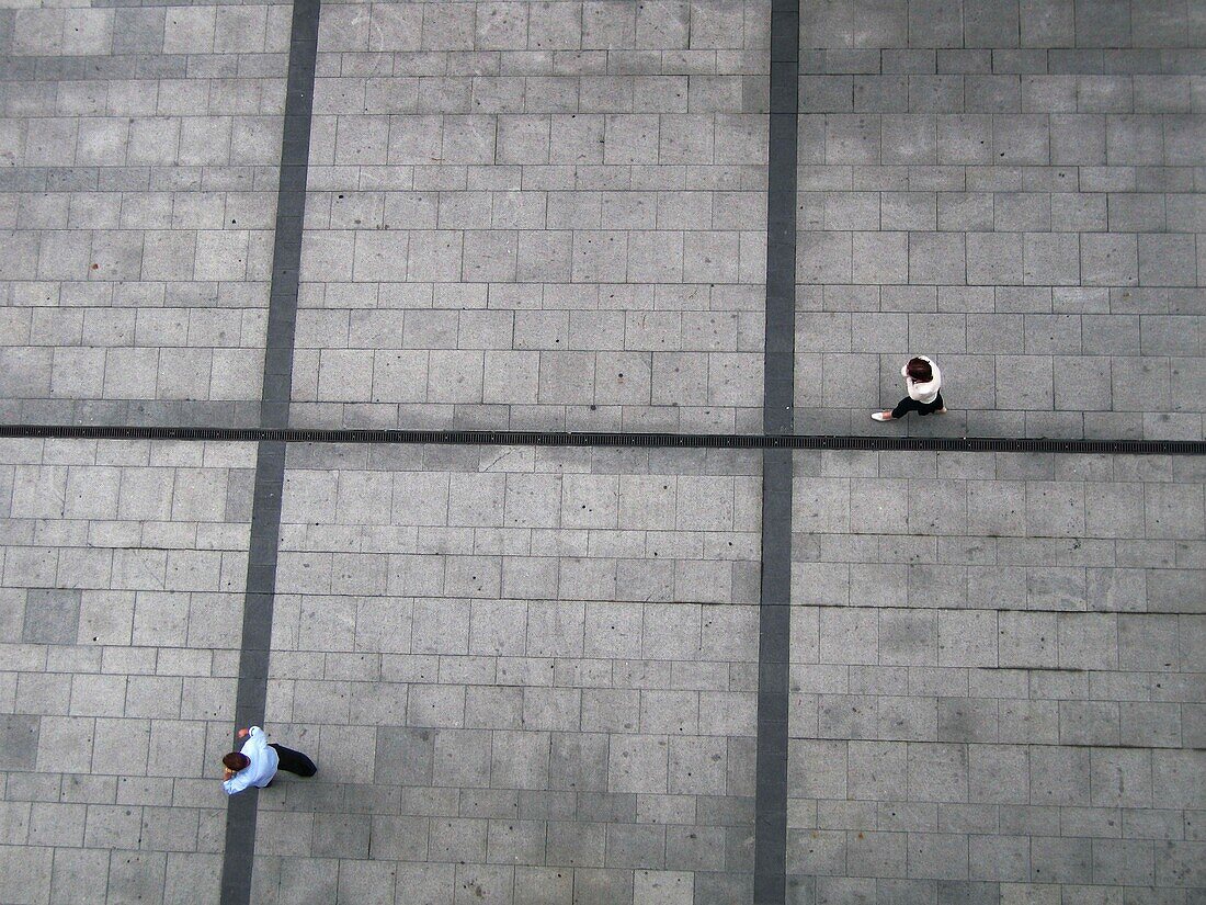 Two People Walking On Pavement, Aerial View