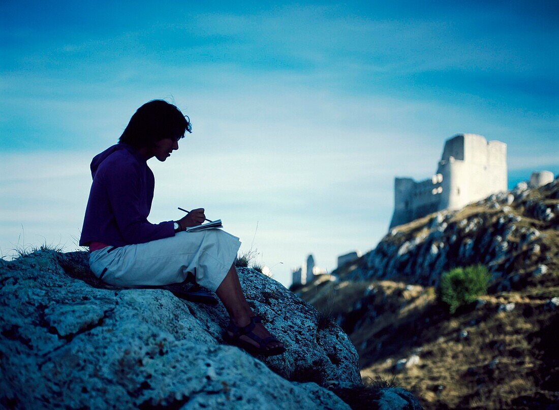 Silhouette Of Woman Sketching The Castle Of Rocca Calascio