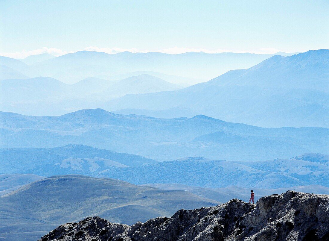 Woman Walking Down Ridge In The Campo Imperatore