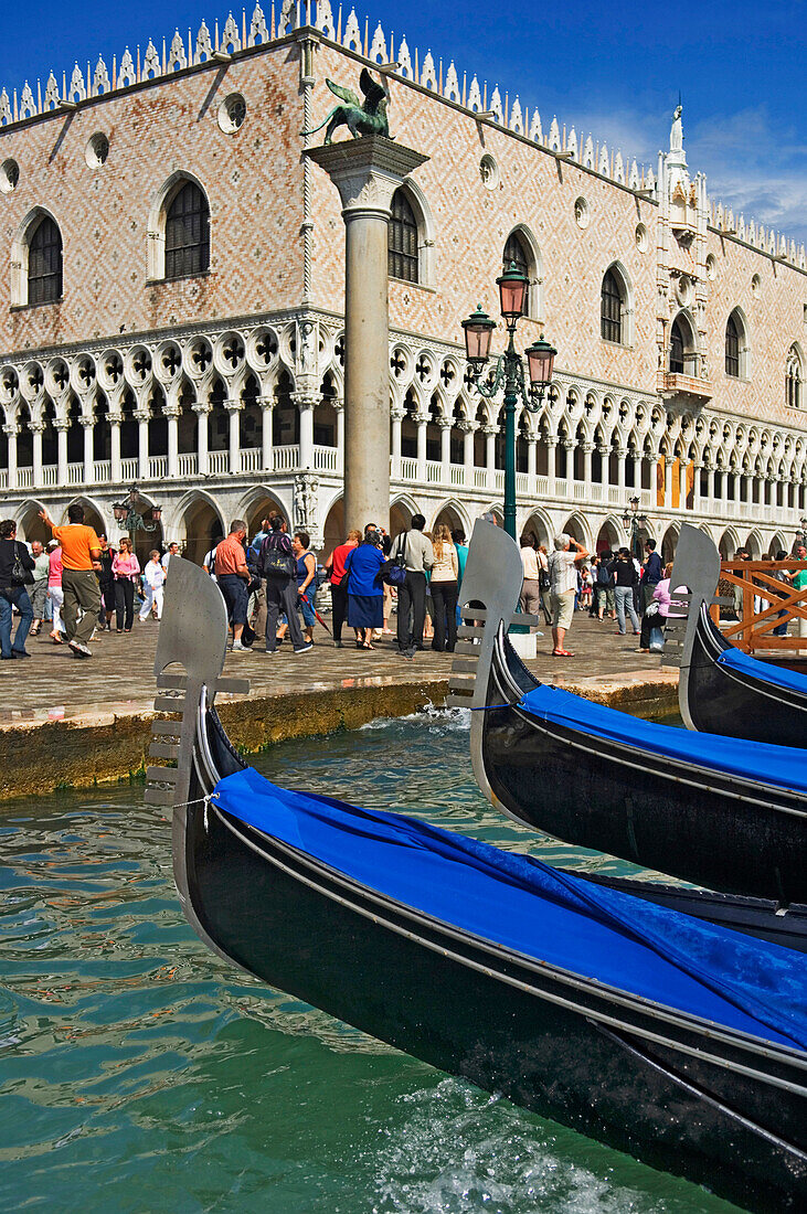 Tourist And Gondolas At Doges' Palace.
